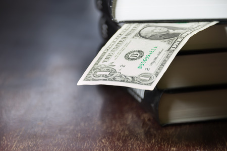 pile of books and moneyの写真素材
