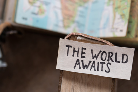 text "The World Awaits" and book, travel, tour,tourism conceptの写真素材