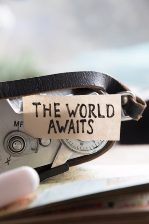 text "The World Awaits" and bookの写真素材