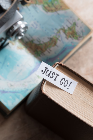 text "Just go" book and map. Travel and tourism concept. Just go text.の写真素材