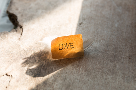 love concept. label on a wooden table.の写真素材