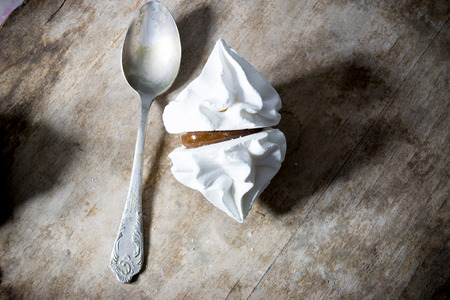 white meringue on a wooden surfaceの写真素材