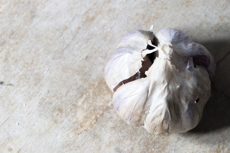 Garlic bulbs on wooden tableの写真素材