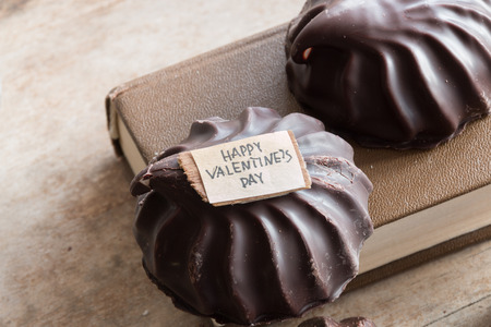 Happy Valentine's Day Hand Lettering, book and chocolate marshmallowの写真素材