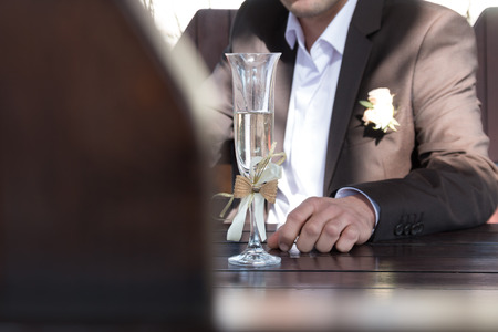 groom with a glassの写真素材