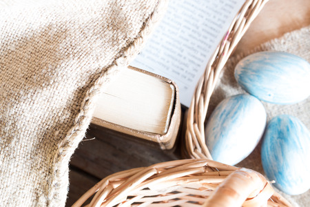Easter background: book, basket and eggs.の写真素材