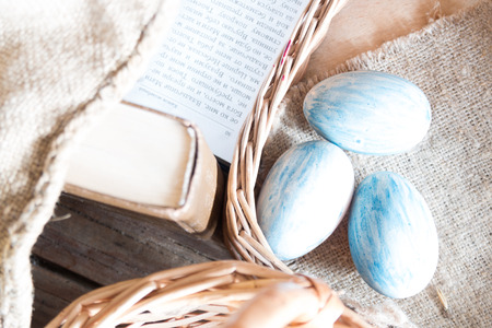 Easter background: book, basket and eggs.の写真素材