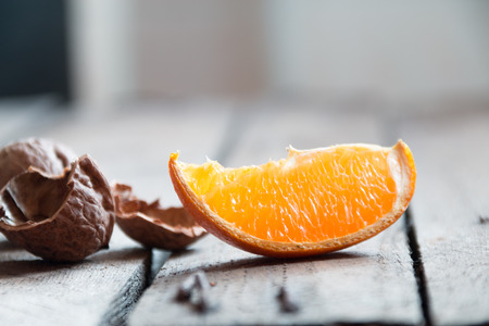 slice of orange on a wooden tableの写真素材