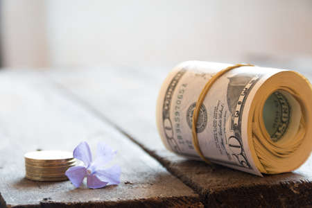 Dollars background. Dollars on a table under a glass cover.の写真素材