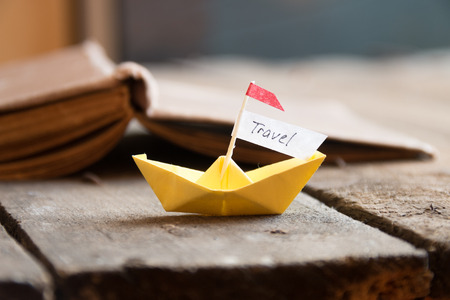 travel card, paper boat and an inscriptionの写真素材