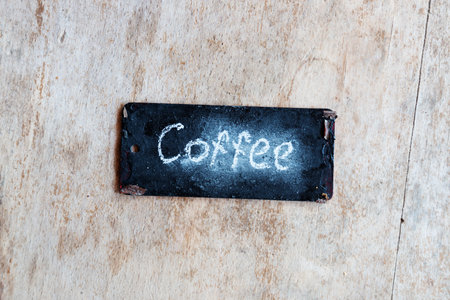 coffee sign, written in chalk, label on a wooden surfaceの写真素材