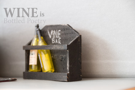 Wine is Bottled Poetry. Wine Bar, written in chalk and bottles.の写真素材