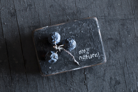 Sign "100 percent natural" and blue berries, Natural food concept. Soft focus.の写真素材