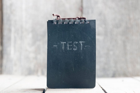 The word TEST. Concept exam or survey, testing.  School test or School exam.