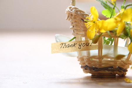 thank you letter tag or label a basket of flowersの写真素材