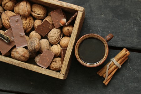 Coffee mug on the table and cinnamonの写真素材