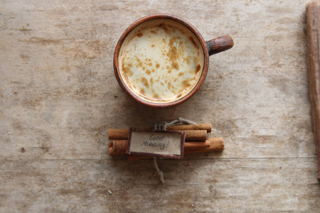 Coffee mug on the table and notes good morning,