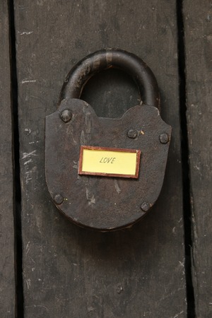 Love text and old padlock, Love relationship married or valentine idea.の写真素材