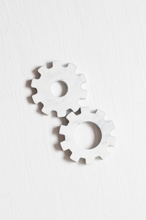 White gears on a on a white table, industry conceptの写真素材
