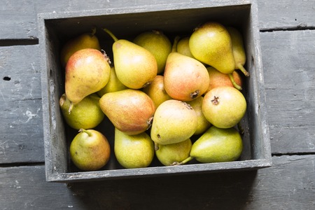Healthy Organic Pears, pears in a box on a wooden tableの写真素材