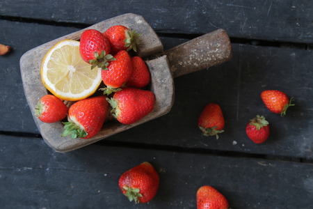 Fresh organic fruit - raspberry, on a rustic wooden tableの写真素材