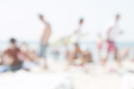 a lot of people on the summer beach, blurred photos for backgroundの写真素材