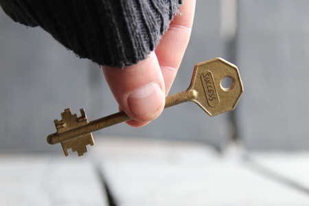 hand holds a key with the word success, vintage styleの写真素材