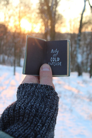Baby its cold outside. Book and text.の写真素材