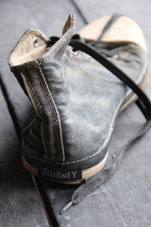 Journey label and retro sneaker shoesの写真素材