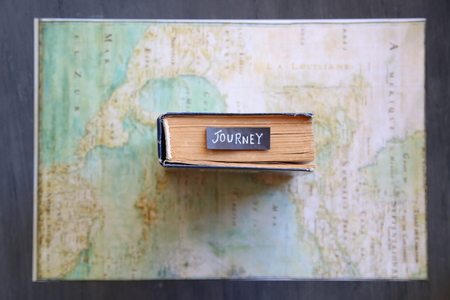 Journey - vintage tag on bookの写真素材