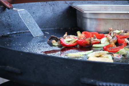 frying pan with colorful vegetables, delicious vegetarian dishの写真素材