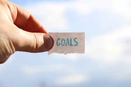 goals idea, tag with inscription, blurred photo for backgroundの写真素材