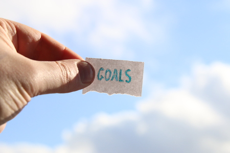 goals idea, tag with inscription, blurred photo for backgroundの写真素材