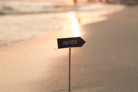 Vacation holidays concept - inscription beach and sunsetの写真素材