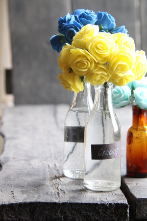 Gracias, thank you in Spanish, tag and flowers in a bottleの写真素材