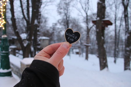 Winter Fun, hand holding a heart shaped plateの写真素材