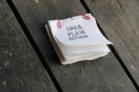 idea plan action, inscription on a white sheet of paper, vintage styleの写真素材