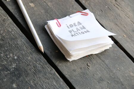 idea plan action concept, inscription on a white sheet of paperの写真素材