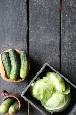 Cucumbers on the wooden table. Raw Organic food.の写真素材