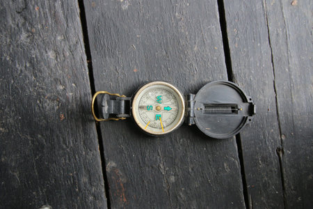 Compass on a wood table. Vintage style.