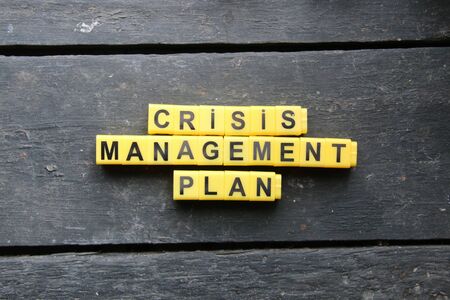 Crisis management plan, inscription on yellow cubes, creative concept, vintage styleの写真素材
