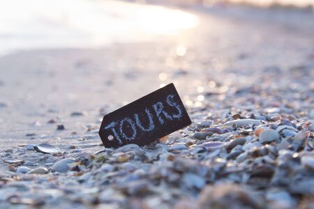 Tours concept. A plate with the inscription on a beautiful beach.の写真素材