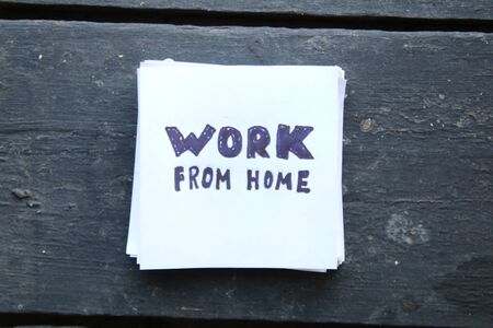 Work from home concept, note on vintage background.の写真素材