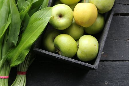 Healthy nutrition concept, apples and green leaves.の写真素材