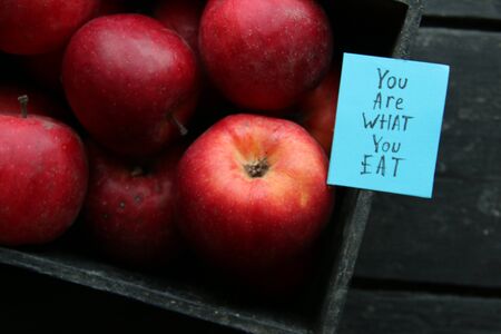 Ripe red apples in wooden box.の写真素材