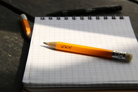 online education concept, pencil on a sheet of paper and the inscriptionの写真素材