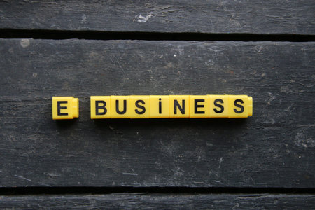 e business concept, inscription of yellow cubes on a vintage backgroundの写真素材