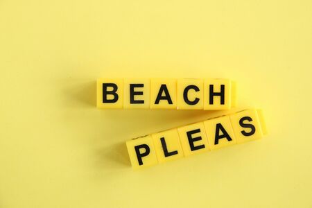 beach please concept, word made of yellow cubes on yellow backgroundの写真素材