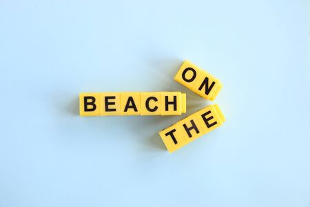 on the beach concept, inscription in yellow letters on a blue backgroundの写真素材