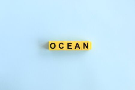 Ocean, lettering on a blue background in yellow lettersの写真素材